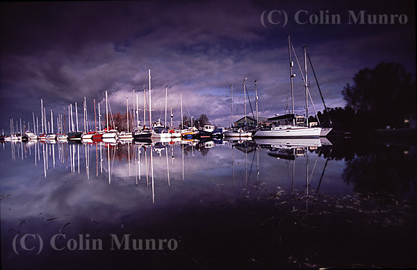 Yachts reflected on the calm waters of Exeter Canal on a winter's day. Image MBI000775.