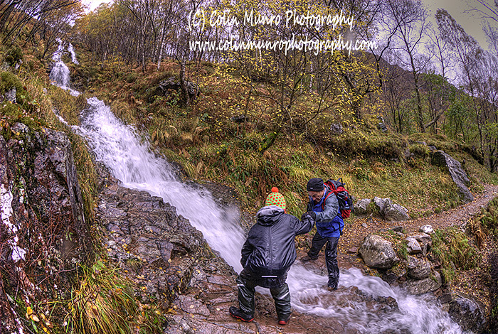 Helping Calum (or Calum helping me?) ford a mountain stream in Glen Nevis. Colin Munro Photography