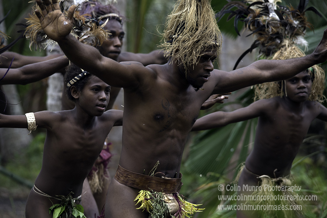 Men perform a traditional dance at a forest village, Malekula Island, Vanuatu. © Colin Munro Photography